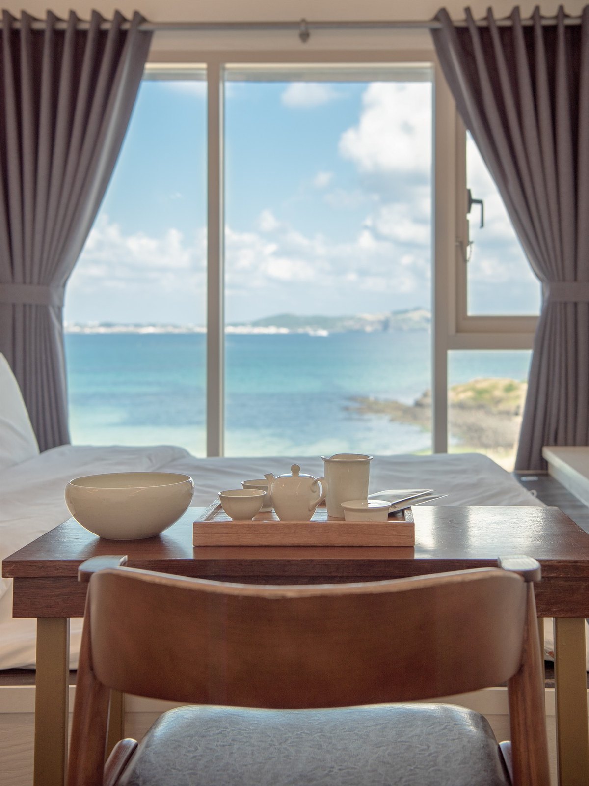 A tea table by the window at Chuidasun, looking out to the sea